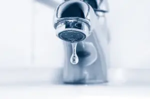 A dripping faucet with low water pressure.